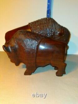 Set of two (2) carved wooden Ironwood buffalo adult and youth sculpture