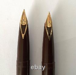 TWO 1960s SCHEAFFER WHITE DOT CARTRIDGE FILL DESK PENS WITH LEATHER STAND