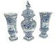 Ancien Ensemble De Garniture Bleu Et Blanc De Delft Comprenant Deux Vases Et Une Urne Couverte, Extrêmement Rare.