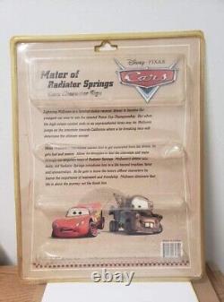 Lot de deux panneaux publicitaires vintage Disney Pixar Cars représentant Lightning Mcqueen et Tow Mater